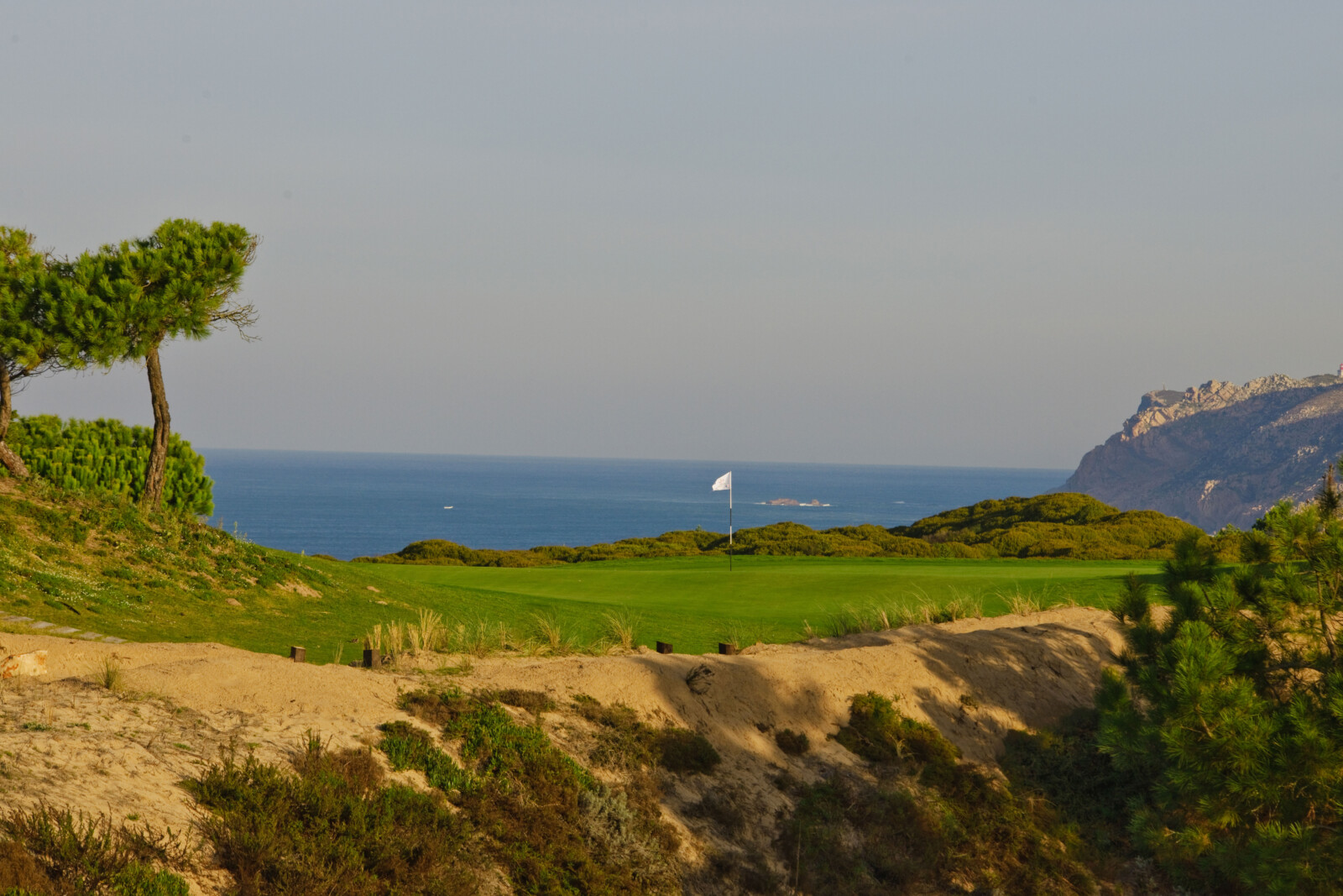 The par-3 14th at Oitavos Dunes requires a carry over a ravine